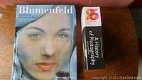 Blumenfeld and A History of Photography books on a wood surface