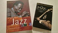 Photo of The Rough Guide to Jazz book cover with a trumpet player and The Jazz Anthology front cover showing a guitar player.