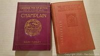 Two vintage books: maroon "Canadian Men of Action: Champlain" and orange "The Official Story of the Canadian Expeditionary Force".