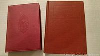 Front covers of two hardcover books by Stephen Leacock, one smaller and one larger, both with red cloth covers.