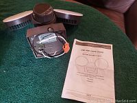 Defiant Motion Security Light, showing back with wiring and use and care guide.