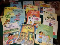 Photo of 17 Sesame Street hardcover books laid out showing titles and colorful illustrated covers