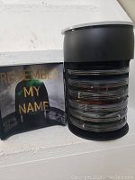 Inside the barrel showing multiple DVD cases stacked