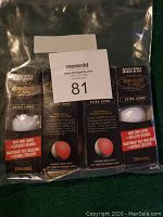 Four boxed sets of Top Flite XL 2000 golf balls, each containing 3 balls, sealed in plastic bag.
