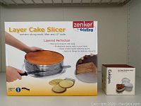 Photo of boxed Zenker Layer Cake Slicer and boxed Cuisipro Ice Cream Sandwich Maker.