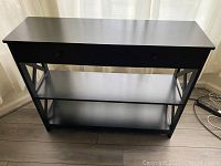 Front view showing two drawers and the two shelves below