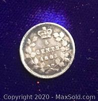 Reverse side of the coin showing '5 CENTS 1885' below a crown surrounded by a wreath.