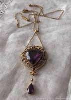 Front view of lavaliere style heart-shaped pendant with faceted heart amethyst and teardrop amethyst drop on chain