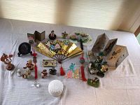 Overview of all small decorative items including Hummels, fans, miniature screens, and animal figurines.