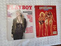 Two vintage Playboy magazines shown side by side on a white textured fabric. The September 1985 Madonna cover issue and the Playboy's Entertaining Women issue.