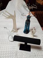 Photo of all four jewelry organizer and display items on a white textured surface