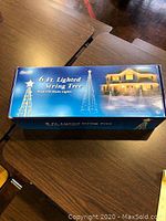 Box of the 6 ft. lighted string tree showing product image and details.