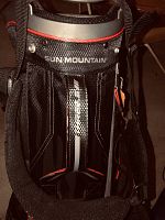 Top of golf bag with Sun Mountain logo, padded carrying strap visible