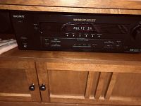 Sony STR-DE595 stereo receiver front view showing power on with display reading MULTI IN.