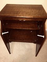 Open cabinet door interior showing one shelf inside for storage