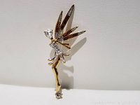Front view of the vintage fairy brooch showing the gold-tone metal and detailed rhinestone wings, body, and head.