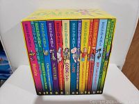 Front view of the 15 Roald Dahl books in colorful binding with titles visible.