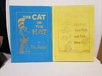 Front covers of two children's books by Dr. Seuss featuring cotton fabric wrapping.