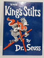 Front cover of the book showing the title The King's Stilts by Dr. Seuss and illustration of a king on red stilts.