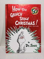 Front cover of the hardcover book showing title, author's name, and Grinch illustration with 50th anniversary emblem.