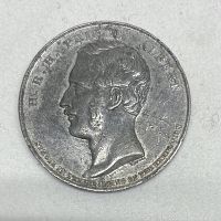 Front side of white metal medal featuring Prince Albert's profile and inscriptions.