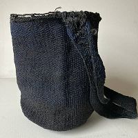 Side angle view of the hand dyed indigo blue market bag showing texture and color variation