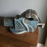 Side front view showing vice body with original paint and "Hamilton Canada" marking