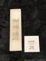 Full view of the three linked rectangular silver filigree panels forming a bracelet, displayed on white background.