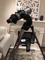 Full assembly showing optical tube on equatorial mount and tripod with controller hanging