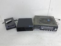 Overview of all items in the lot: mini DVD player with remote, computer tower, and record/cassette/AM-FM radio system with turntable