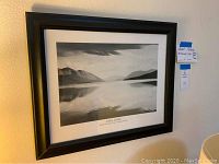 Frontal photo of the framed black and white Ansel Adams print labeled 'McDonald Lake, Glacier National Park' showing overall condition and frame.