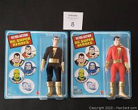 Front of sealed packaging showing Shazam and Black Adam action figures against blue background with Retro Action DC Superheroes branding.
