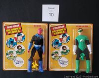 Front view of sealed Green Lantern and Sinestro Retro Action DC Superheroes figures on yellow card with character illustrations