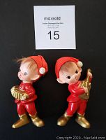 Front view of the two vintage Inarco Japan Christmas elf figurines, showing detailed faces and musical instruments.