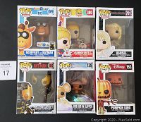 Front view of boxed Funko Pop figures showing characters Geoffrey as Batman, Rainbow Brite and Twink, Hansel, Yellowjacket, Gus Gus, and Pumpkin King.