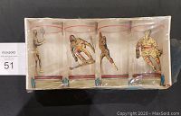 Set of four clear glasses with colored sports player designs, sealed in original box