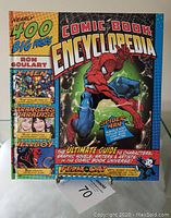 Front cover of the Comic Book Encyclopedia showing Spider-Man and Hellboy, with mentions of X-Men and Strangers Paradise.
