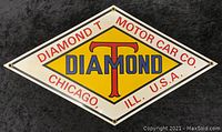 Front view of diamond-shaped heavy porcelain enamel sign with yellow, red, white, and blue lettering and colors.