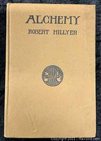 Front cover of the book titled Alchemy by Robert Hillyer, showing beige cover with title and emblem.