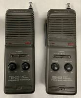 Front view of two Realistic TRC-223 CB transceivers showing speaker grills, control knobs and channel selector switches.