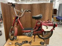 Red Cimatti City Bike moped on display table, left side view