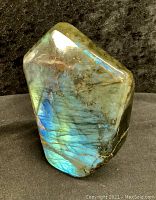 Front iridescent face of the labradorite showing vibrant blue and green flashes.