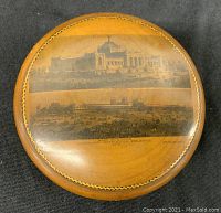Top view of lid showing leather or faux leather cover with photographic images of the 1876 Centennial International Exhibition, Philadelphia.