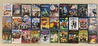 Photo showing front view of all 30 children's DVDs displayed in three rows on a flat surface.