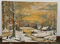 Full view photo of the pastel snowy landscape on board showing trees, stream, bridge, houses, and snowfall scene.
