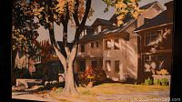 Photo of oil painting on canvas panel showing houses with a large tree in autumn colors, professionally framed with steel frame.