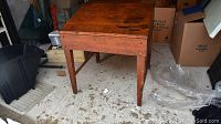 Front and side view of vintage flip top school desk made from Quebec pine, showing its warm patina and wear marks.