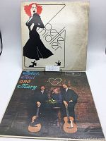 Front view of Bette Midler album cover with stylized illustration and Peter, Paul and Mary album cover showing trio with guitars.