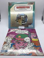 Front covers of two vinyl record albums: Gangbusters and Spike Jones 'Murdering the Classics'.
