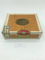 Top view of the wooden cigar box showing the Bering C. W. y Ca Havana label and Claro cigar label on the lid, including handwritten notes visible on the surface.